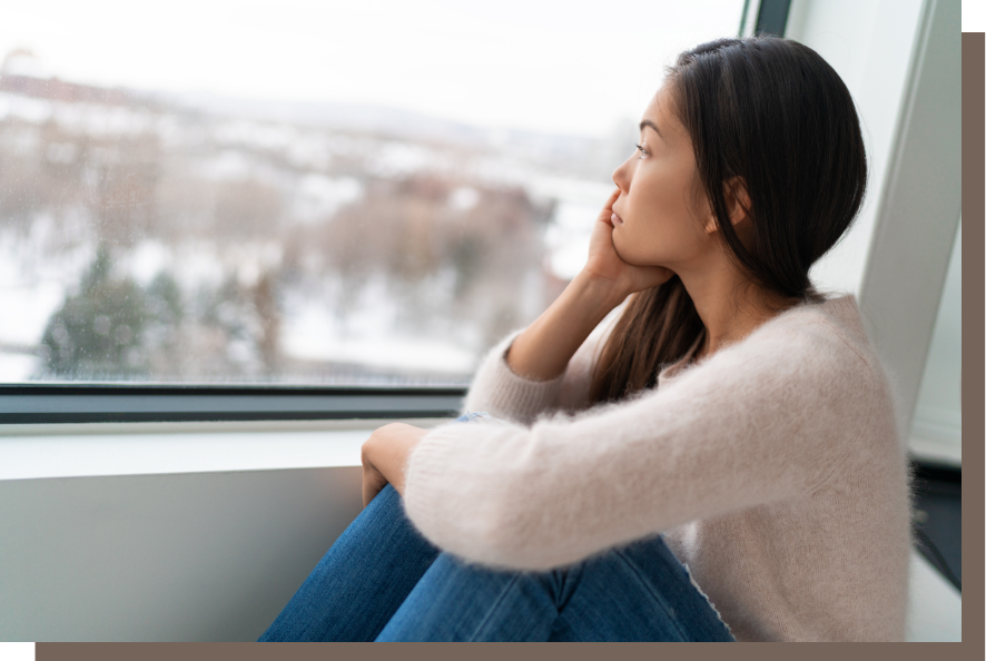 Woman waiting for clients Woman staring wistfully out the window, waiting for clients to appear