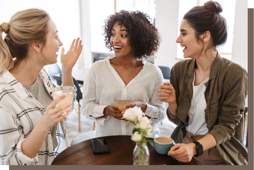 The psychological shortcut to getting clients 3 women having coffee together. One woman is explaining how her offer works